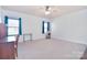 Bright bedroom with neutral walls and ample space at 5600 Ballenger Ct, Waxhaw, NC 28173