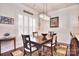 Bright dining room featuring a wood table and elegant chandelier at 5600 Ballenger Ct, Waxhaw, NC 28173