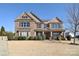 Charming two-story brick home with symmetrical design, manicured landscaping, and welcoming front porch at 5600 Ballenger Ct, Waxhaw, NC 28173