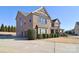 Brick home with two-car garage and manicured landscaping at 5600 Ballenger Ct, Waxhaw, NC 28173