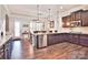 Open concept kitchen with island and stainless steel appliances at 5600 Ballenger Ct, Waxhaw, NC 28173