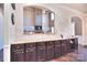 Kitchen with granite countertops, dark cabinets and a view of the living room at 5600 Ballenger Ct, Waxhaw, NC 28173