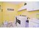 Laundry room features washer, dryer and utility sink at 5600 Ballenger Ct, Waxhaw, NC 28173