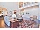 Two-story living room with hardwood floors, large windows, and a view of the kitchen at 5600 Ballenger Ct, Waxhaw, NC 28173