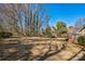 Expansive backyard featuring a sprawling lawn and mature trees, perfect for outdoor activities and relaxation at 5701 Glenshire Ct, Charlotte, NC 28269