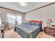 Bedroom featuring large windows and quilted comforter at 5701 Glenshire Ct, Charlotte, NC 28269