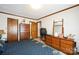 Bedroom with vintage dressers and mirror at 5701 Glenshire Ct, Charlotte, NC 28269