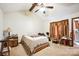 Cozy bedroom featuring a ceiling fan, comfortable bed, and side tables at 5701 Glenshire Ct, Charlotte, NC 28269