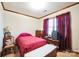 Cozy bedroom with wood trim and neutral carpet at 5701 Glenshire Ct, Charlotte, NC 28269