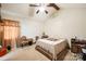 Bedroom featuring a ceiling fan, comfortable bed, side tables, and chair at 5701 Glenshire Ct, Charlotte, NC 28269