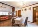 Inviting dining area with vintage chandelier, connected to the living room at 5701 Glenshire Ct, Charlotte, NC 28269