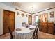 Cozy dining room with charming chandelier and neutral carpet at 5701 Glenshire Ct, Charlotte, NC 28269