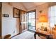 Well-lit foyer with carpet, a wooden door and a decorative lamp on a small table at 5701 Glenshire Ct, Charlotte, NC 28269