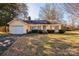 Charming single-story home with a well-maintained front yard and attached one-car garage at 5701 Glenshire Ct, Charlotte, NC 28269