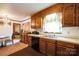 Functional kitchen featuring wood cabinets, white countertops, and plenty of space at 5701 Glenshire Ct, Charlotte, NC 28269