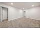 Unfinished basement with neutral carpeting and multiple rooms at 717 Windage Way, Pineville, NC 28134