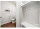 Convenient half bathroom with toilet and bench for extra storage at 717 Windage Way, Pineville, NC 28134