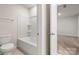 Bathroom with shower/tub combo and neutral tile floors at 717 Windage Way, Pineville, NC 28134