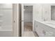 Clean bathroom with double vanity and a bathtub at 717 Windage Way, Pineville, NC 28134