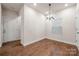 Bright dining room with hardwood floors and a chandelier at 717 Windage Way, Pineville, NC 28134