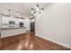 Modern kitchen features white cabinets, stainless steel appliances, and an island at 717 Windage Way, Pineville, NC 28134