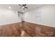 Hardwood floor living room with ceiling fan at 717 Windage Way, Pineville, NC 28134