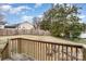 View from deck showcasing fenced backyard, firepit, and mature trees at 844 Turning Point Ln, Concord, NC 28027