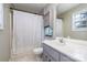 Bathroom with shower/tub combo, vanity, and linen cabinet at 844 Turning Point Ln, Concord, NC 28027