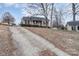 House's front yard with a long driveway leading to the front door at 844 Turning Point Ln, Concord, NC 28027