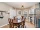 Bright kitchen with teal cabinets and an eat-in dining area at 844 Turning Point Ln, Concord, NC 28027