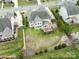 Aerial view of the home with spacious backyard and a deck off the back of the house at 8509 Penton Pl, Harrisburg, NC 28075