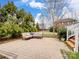 Beautiful brick patio with comfortable seating perfect for relaxing outdoors at 8509 Penton Pl, Harrisburg, NC 28075