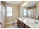 Full bathroom featuring a vanity with dual sinks and a shower with a curtain at 8509 Penton Pl, Harrisburg, NC 28075