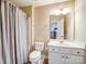 Full bathroom featuring a single vanity, a toilet, and a bathtub with shower curtain at 8509 Penton Pl, Harrisburg, NC 28075