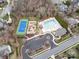 Aerial view of the community pool, tennis court, and playground area at 8509 Penton Pl, Harrisburg, NC 28075