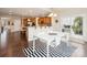 Open dining area with a sliding door and a modern white table at 8509 Penton Pl, Harrisburg, NC 28075