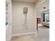 Neutral hallway featuring a full-length mirror, leading to bedrooms with lots of natural light at 8509 Penton Pl, Harrisburg, NC 28075