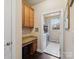 Functional laundry room with built-in cabinets, granite countertops, and modern washer and dryer, simplifying chores at 8509 Penton Pl, Harrisburg, NC 28075