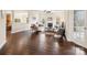 Cozy living room featuring hardwood floors, a fireplace, coffered ceilings, and neutral decor for relaxation at 8509 Penton Pl, Harrisburg, NC 28075