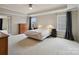 Expansive main bedroom with tray ceilings, neutral tones, and ample natural light, offering a serene retreat at 8509 Penton Pl, Harrisburg, NC 28075