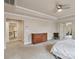 Spacious main bedroom featuring tray ceilings, neutral tones, and a wooden dresser, creating a tranquil atmosphere at 8509 Penton Pl, Harrisburg, NC 28075