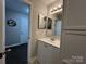 Clean bathroom with updated vanity and flooring at 9041 J M Keynes Dr # 10, Charlotte, NC 28262