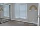 Spacious bedroom with mirrored closet and tile floors at 9041 J M Keynes Dr # 10, Charlotte, NC 28262