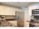 Modern kitchen with stainless steel appliances and white cabinets at 9041 J M Keynes Dr # 10, Charlotte, NC 28262