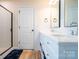 Well-lit bathroom featuring double sinks, modern fixtures, and a glass-enclosed shower at 9489 Westridge Dr, Hickory, NC 28601