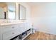 Modern bathroom with double vanity, framed mirrors, ample storage, and elegant fixtures at 9489 Westridge Dr, Hickory, NC 28601