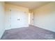 Bedroom boasts neutral walls, carpeting, and a closet for storage at 9489 Westridge Dr, Hickory, NC 28601