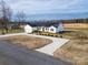 Beautiful home with solar panels, a long driveway, and manicured landscaping at 9489 Westridge Dr, Hickory, NC 28601