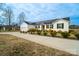 Attractive front exterior view of the home with solar panels and a driveway at 9489 Westridge Dr, Hickory, NC 28601