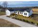 Beautiful one-story home featuring solar panels, a well-manicured lawn, and a long driveway at 9489 Westridge Dr, Hickory, NC 28601